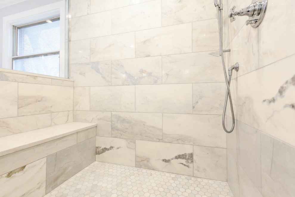 This is an example of a large traditional master bathroom in Chicago with beaded inset cabinets, white cabinets, a freestanding tub, a corner shower, gray tile, grey walls, marble floors, an undermount sink, engineered quartz benchtops, grey floor, a hinged shower door, white benchtops, a shower seat, a double vanity, a freestanding vanity and decorative wall panelling.