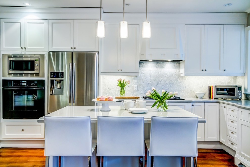 Example of a transitional kitchen design in Toronto