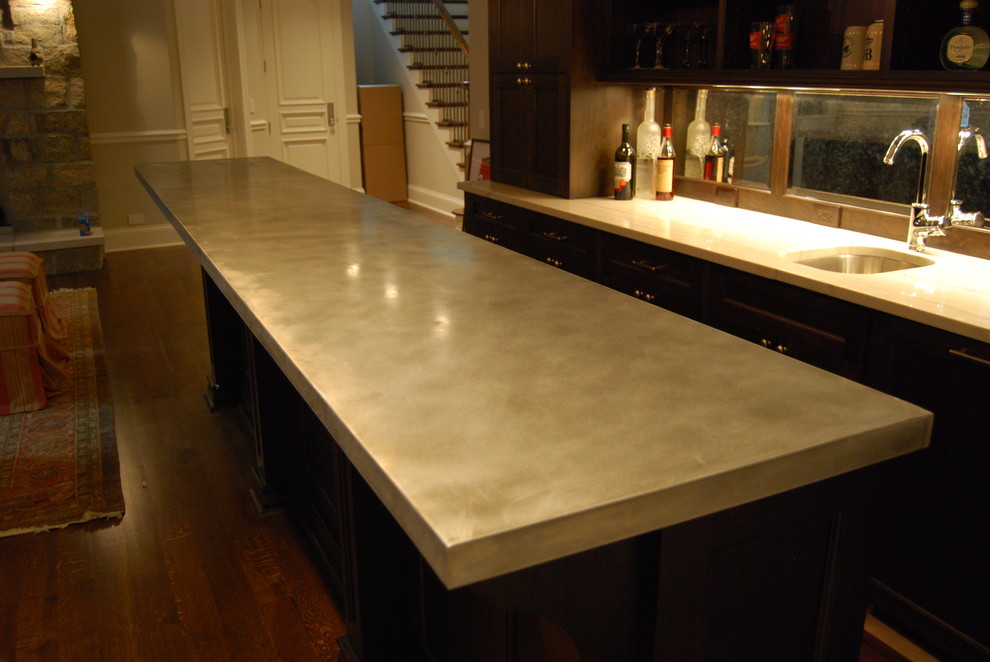 Example of a mid-sized transitional galley dark wood floor and brown floor home design design in Chicago with an undermount sink, shaker cabinets, brown cabinets, zinc countertops and mirror backsplash