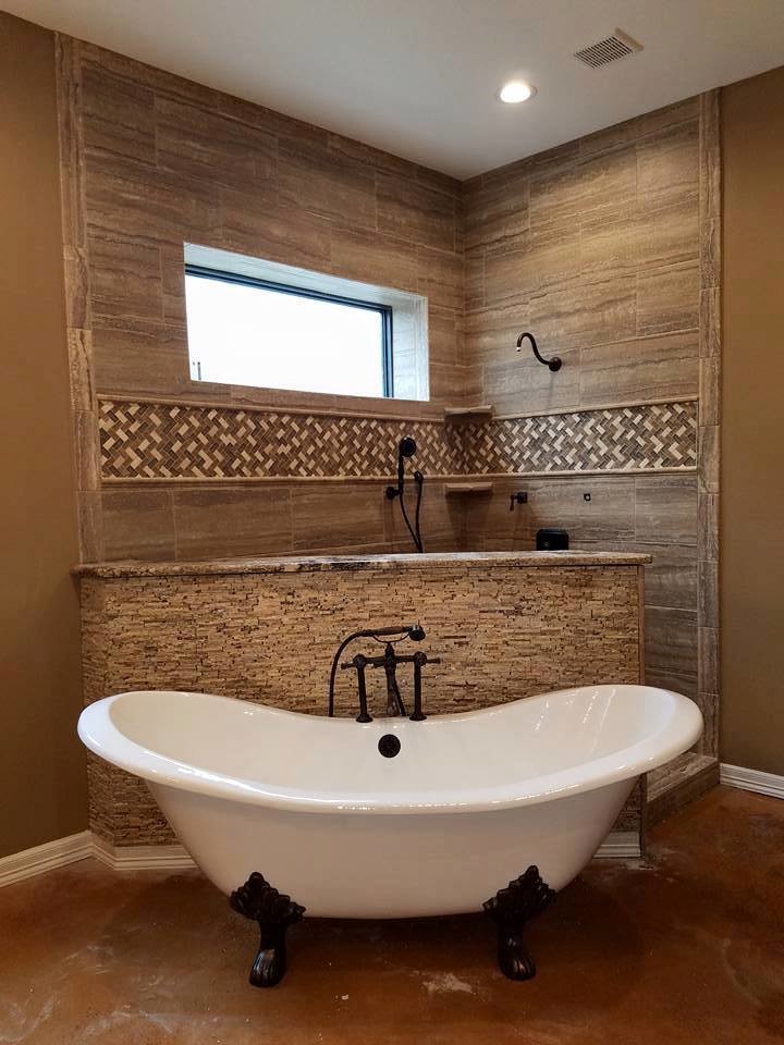 Inspiration for a large traditional master bathroom in Austin with a claw-foot tub, an open shower, porcelain tile, concrete floors, brown floor and an open shower.