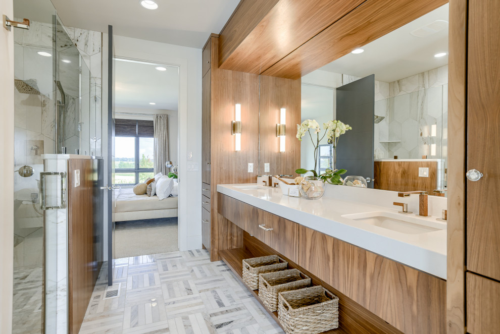Photo of a modern master bathroom in Omaha with flat-panel cabinets, a double shower, a one-piece toilet, marble, marble floors, an undermount sink, engineered quartz benchtops, a hinged shower door, an enclosed toilet, a double vanity, a built-in vanity and wood walls.
