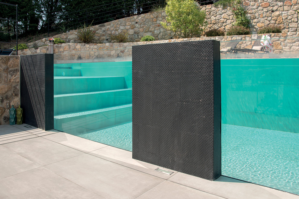 Inspiration for a modern rectangular pool in Bologna with with a pool and tile.