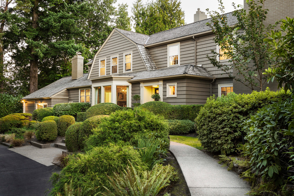Design ideas for a large traditional two-storey grey exterior in Portland with wood siding.