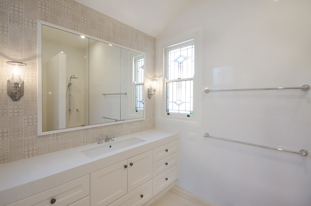 Inspiration for a large traditional master bathroom in Melbourne with an undermount sink, shaker cabinets, white cabinets, engineered quartz benchtops, an open shower, a one-piece toilet, beige tile, mosaic tile, white walls, ceramic floors, beige floor and an open shower.