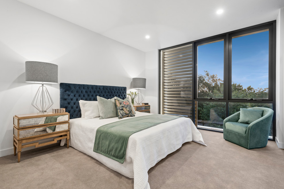 This is an example of a contemporary bedroom in Melbourne.