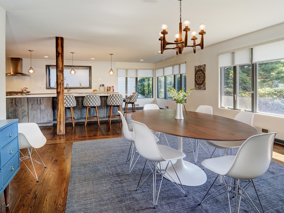 Trendy dark wood floor kitchen/dining room combo photo in Newark with white walls and no fireplace
