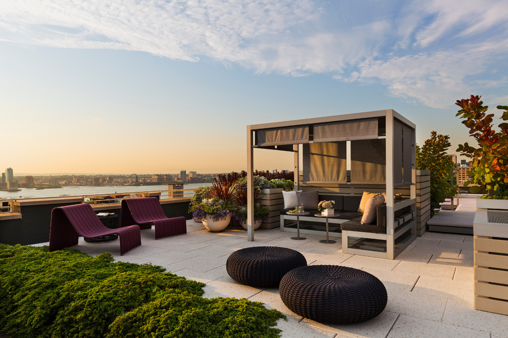 Design ideas for a contemporary patio in New York with a gazebo/cabana.
