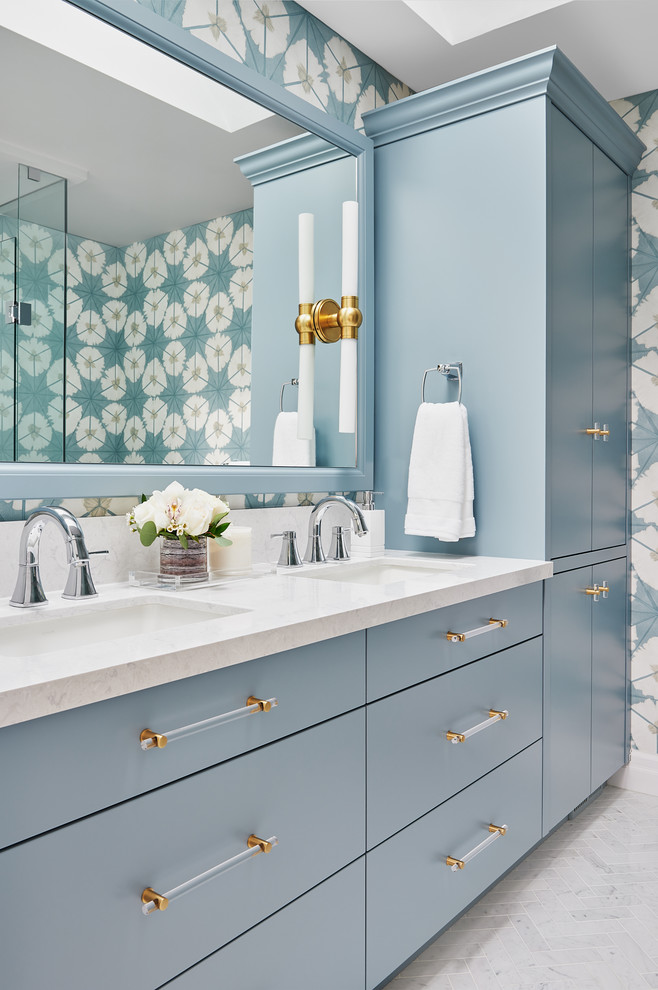 Design ideas for a mid-sized transitional master bathroom in Toronto with flat-panel cabinets, blue cabinets, an alcove shower, a one-piece toilet, blue tile, blue walls, marble floors, an undermount sink, engineered quartz benchtops, a hinged shower door and grey floor.