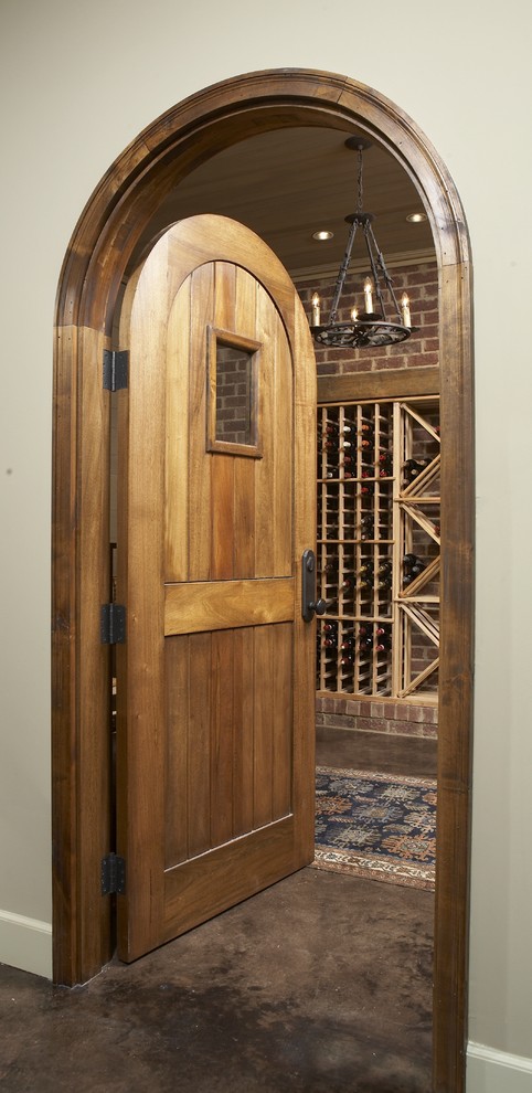 Traditional wine cellar in Birmingham with concrete floors.