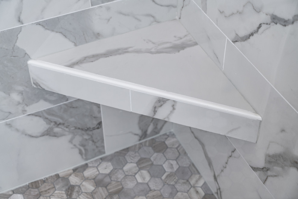 Large transitional master multicolored tile and mosaic tile porcelain tile double shower photo with gray walls, an undermount sink and quartz countertops