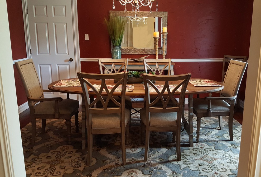 Inspiration for a small transitional separate dining room in Other with red walls, medium hardwood floors and brown floor.