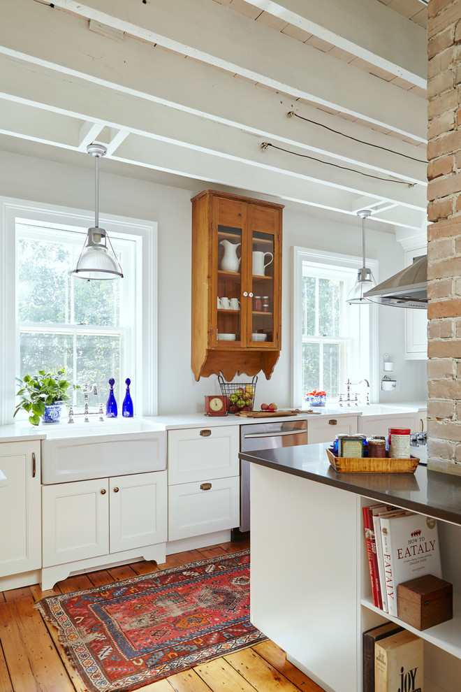 Inspiration for a mid-sized transitional u-shaped separate kitchen in Toronto with a farmhouse sink, shaker cabinets, white cabinets, marble benchtops, multi-coloured splashback, stone tile splashback, stainless steel appliances, medium hardwood floors and with island.