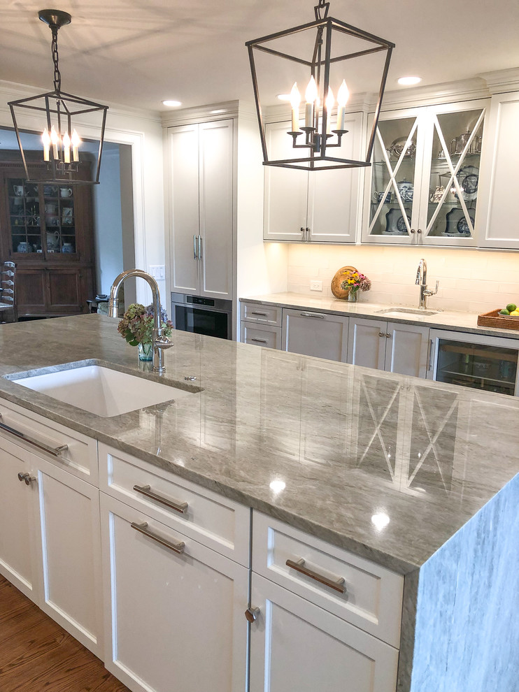 Example of a transitional kitchen design with quartzite countertops and gray countertops