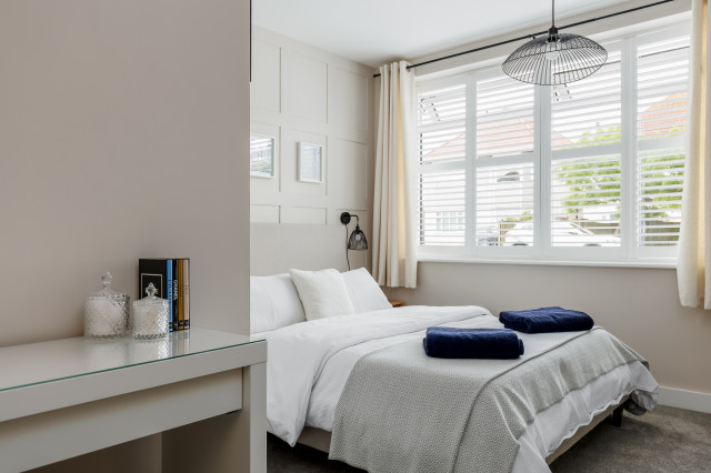 Modern beach themed apartment coastal-bedroom