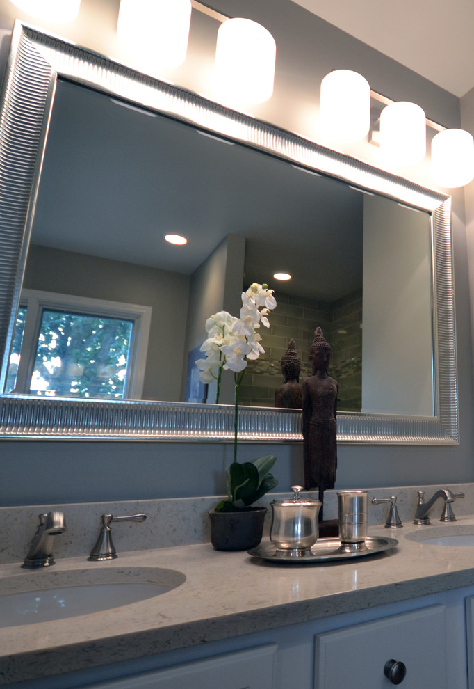 Example of a mid-sized transitional master gray tile and subway tile limestone floor freestanding bathtub design in Chicago with an undermount sink, flat-panel cabinets, white cabinets, quartz countertops, a two-piece toilet and gray walls
