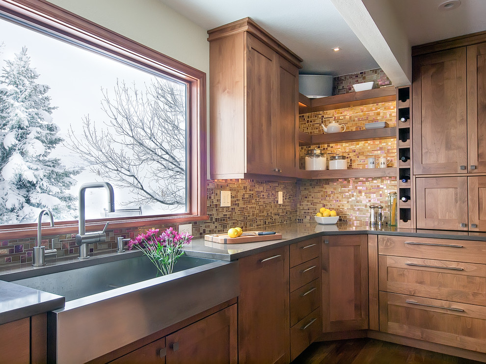 Photo of an arts and crafts kitchen in Denver with a farmhouse sink, shaker cabinets, medium wood cabinets, multi-coloured splashback and mosaic tile splashback.