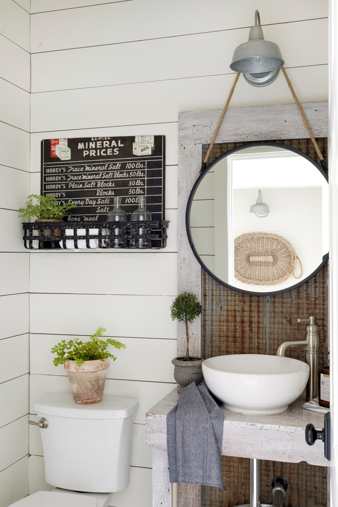 Cottage powder room photo in Minneapolis with white walls and a drop-in sink