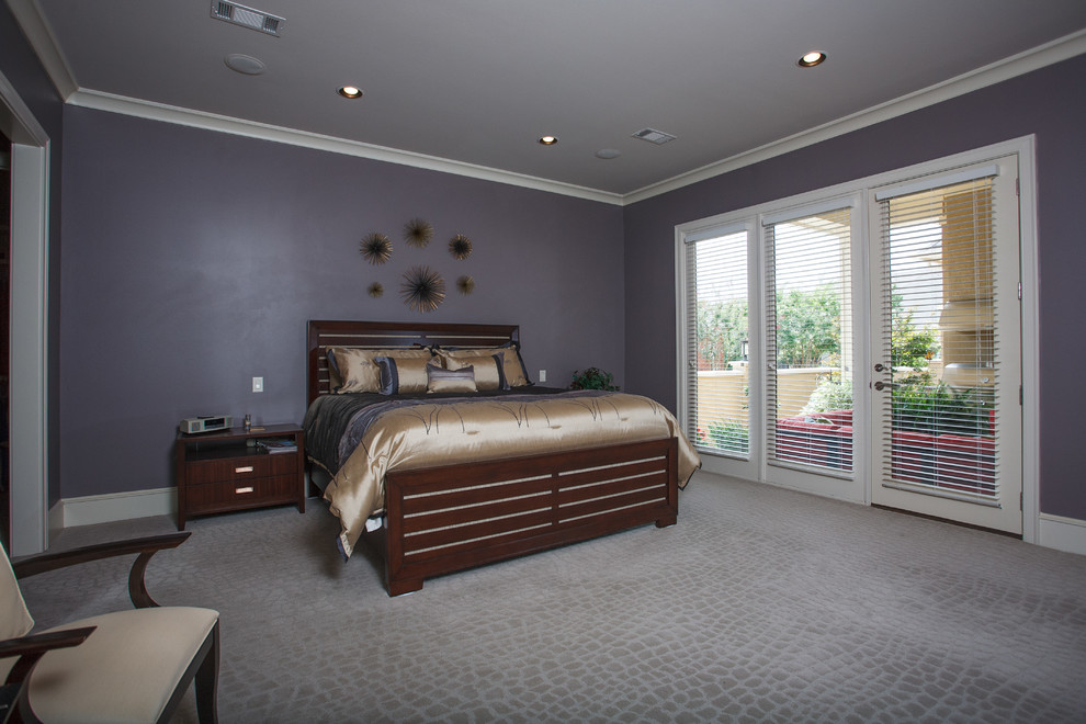 Photo of a large contemporary master bedroom in Little Rock with purple walls, carpet, no fireplace and grey floor.