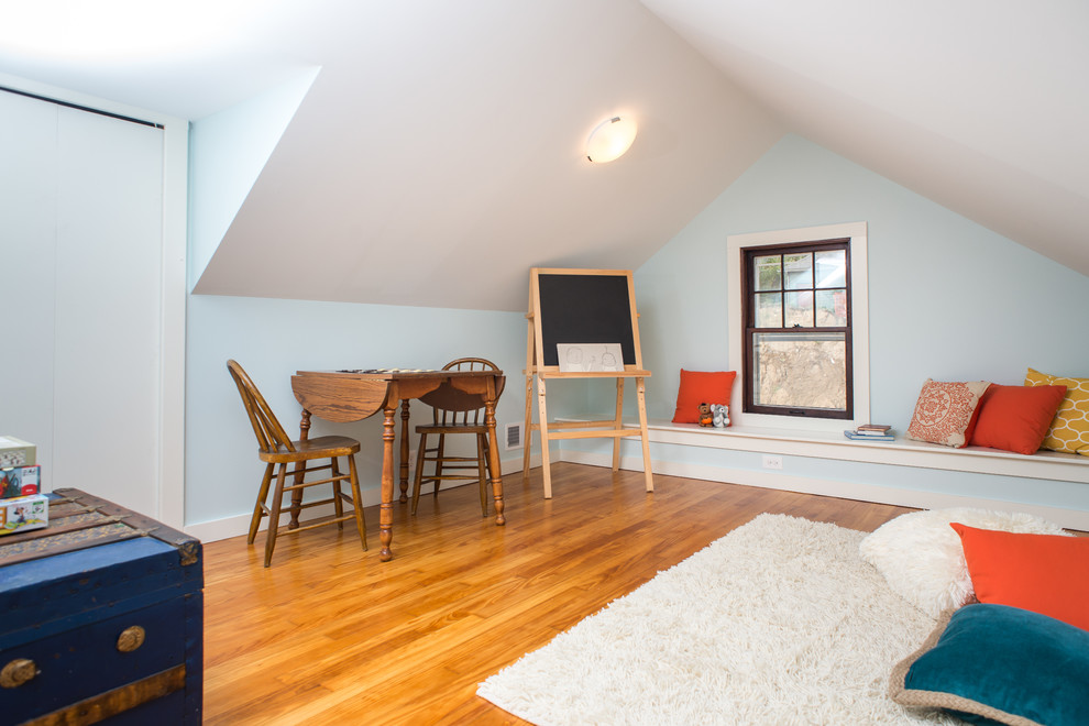 This is an example of a small traditional gender-neutral kids' playroom for kids 4-10 years old in Detroit with blue walls and medium hardwood floors.