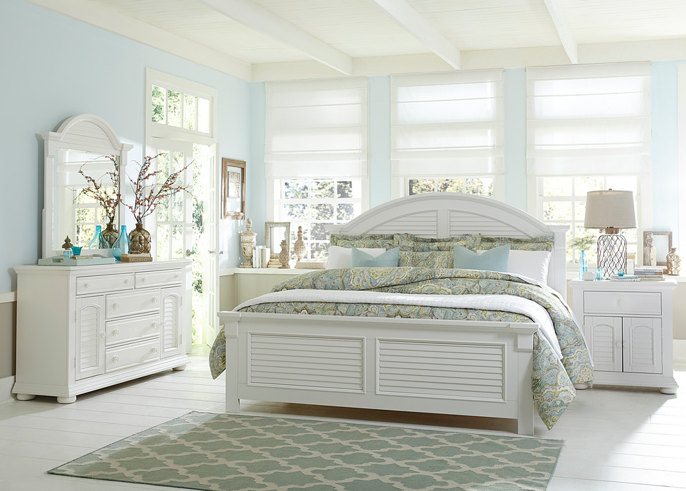 This is an example of a beach style bedroom in Other with blue walls.