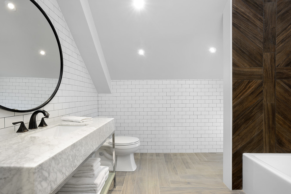 Mid-sized transitional master gray tile, white tile and porcelain tile bathroom photo in Toronto with open cabinets, a two-piece toilet, white walls, an undermount sink and marble countertops