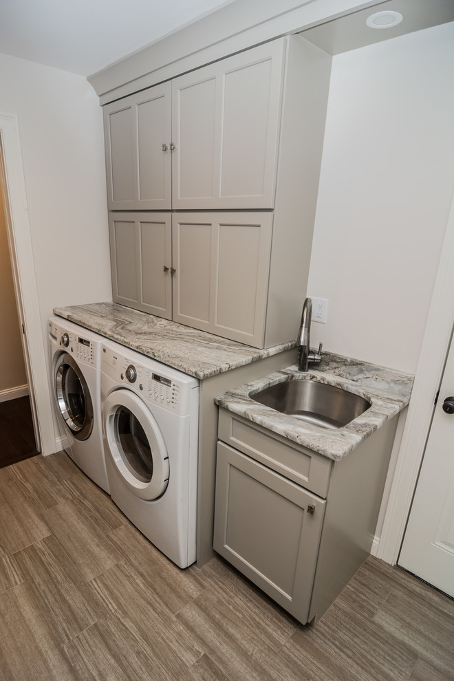 Transitional laundry room in Boston.