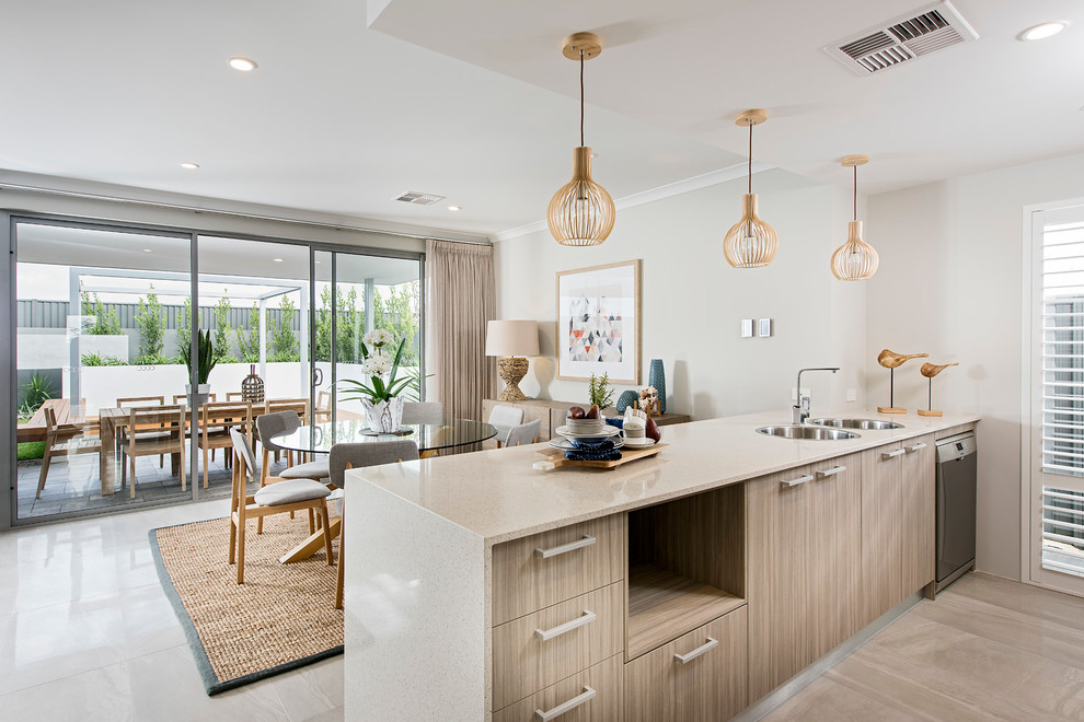 Inspiration for a beach style kitchen in Perth with a double-bowl sink, stainless steel appliances, flat-panel cabinets, medium wood cabinets and a peninsula.