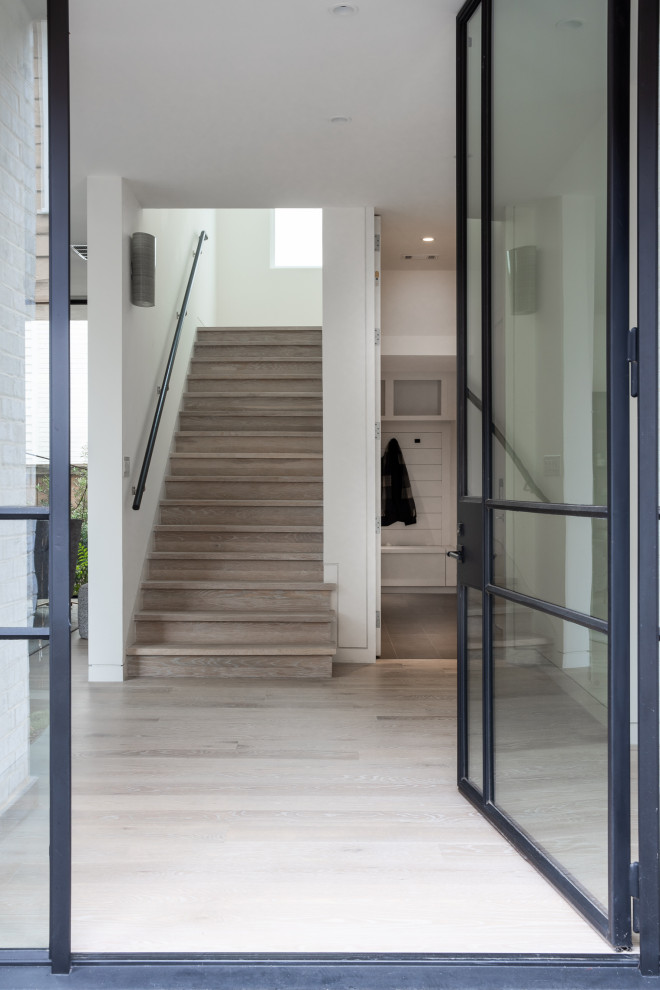 Modern Entry with Steel Glass Door, Light Oak Floors & Architectural ...