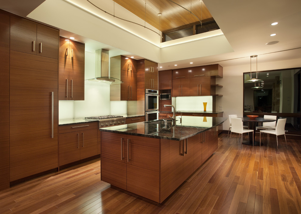 This is an example of a modern kitchen in Denver with panelled appliances.