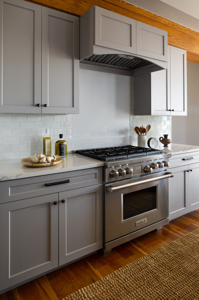 Example of a transitional kitchen design in Denver