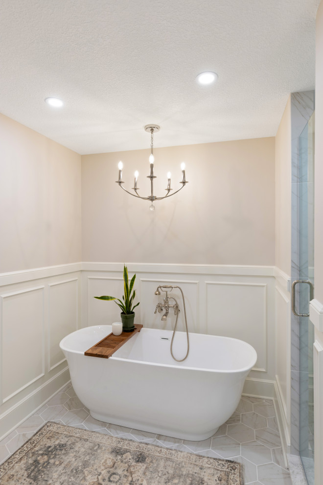 Photo of a large traditional ensuite bathroom in Kansas City with flat-panel cabinets, white cabinets, a wall niche, double sinks, a built in vanity unit and wainscoting.