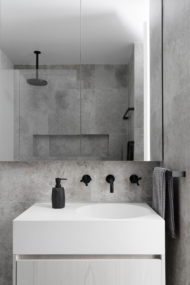 This is an example of a contemporary bathroom in Melbourne with flat-panel cabinets, light wood cabinets, grey walls and a drop-in sink.