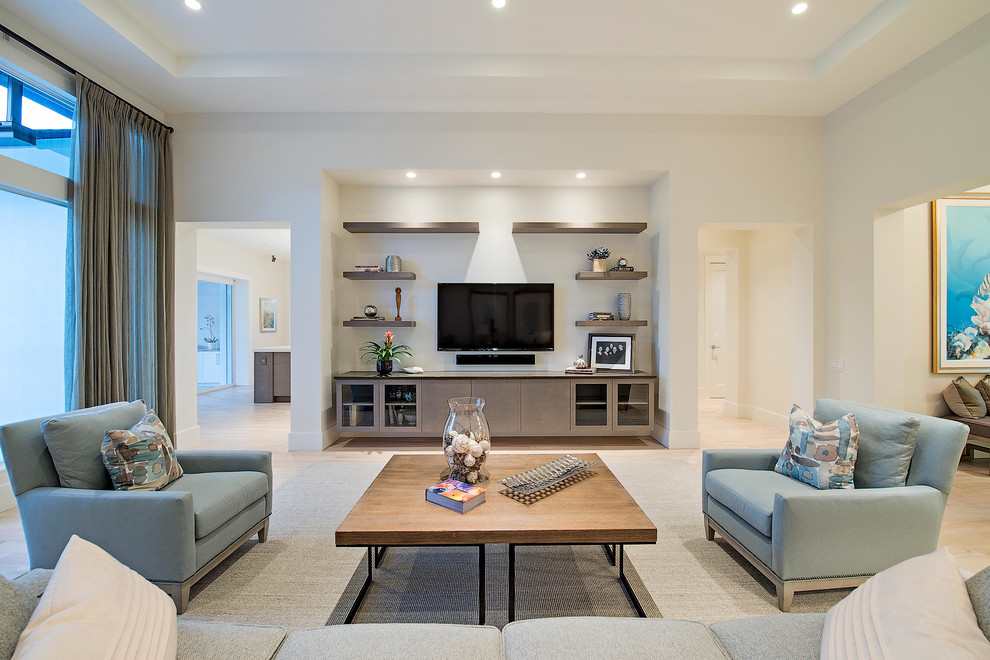 This is an example of a contemporary open concept family room in Other with white walls, no fireplace and a wall-mounted tv.