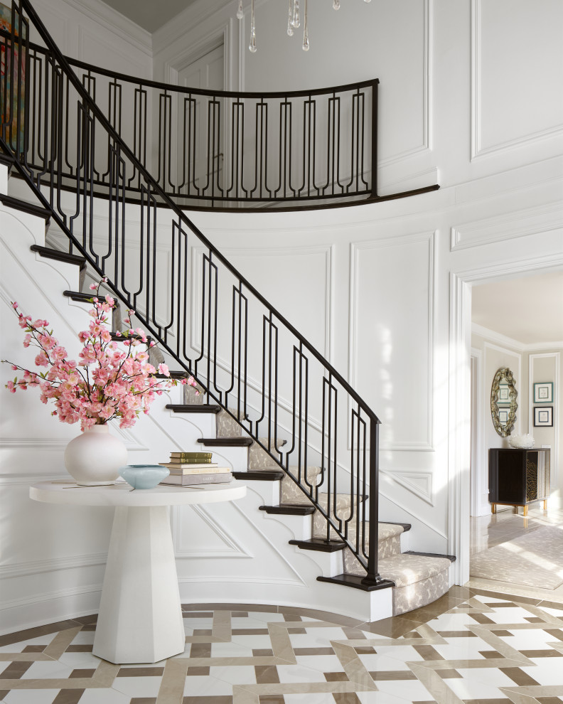 Staircase - large modern curved metal railing and wall paneling staircase idea in Philadelphia
