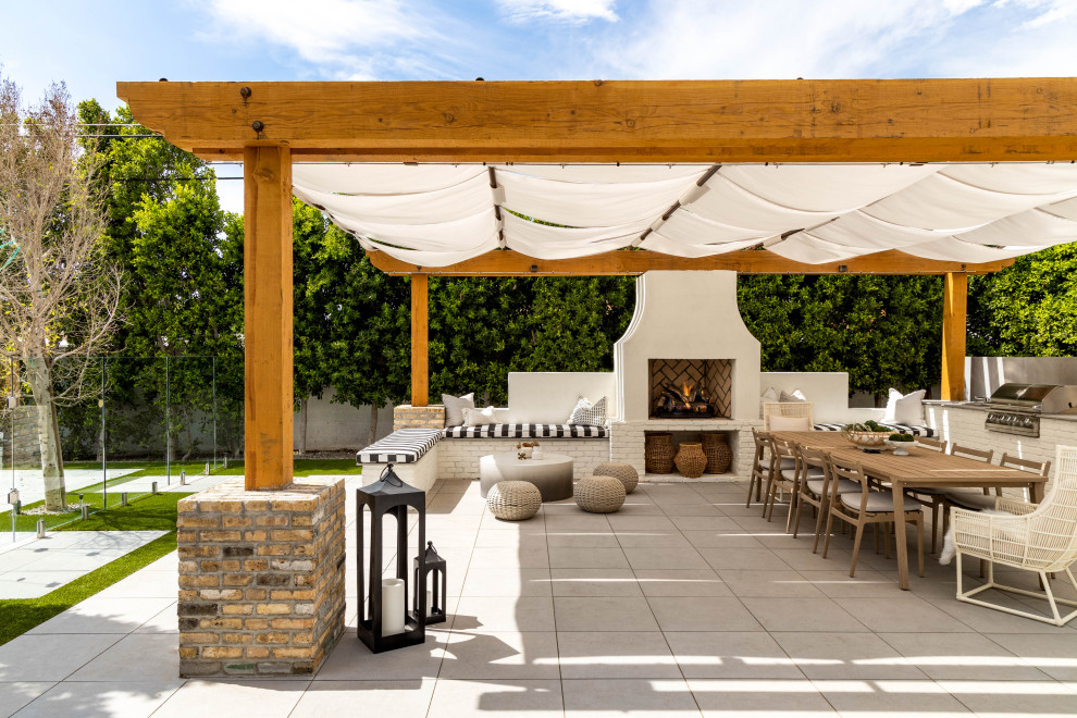 Large contemporary backyard patio in Phoenix with concrete pavers.