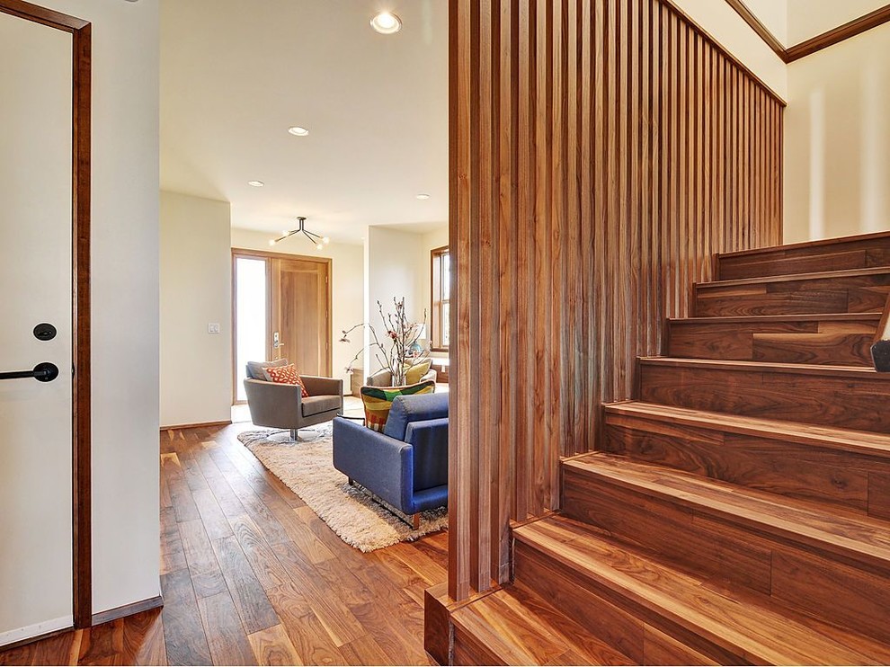 Inspiration for a midcentury wood staircase in Vancouver with wood risers.