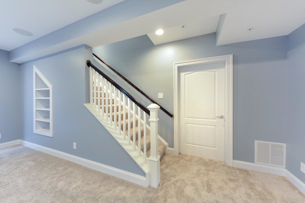 Inspiration for a mid-sized transitional carpeted straight wood railing staircase remodel in DC Metro with carpeted risers