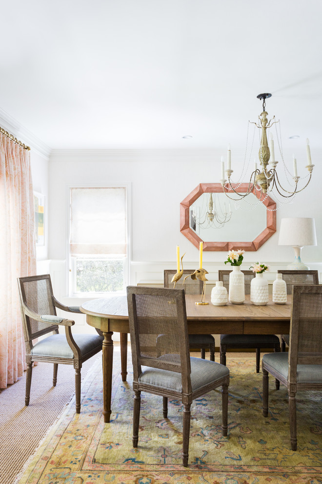 Transitional dining room in Los Angeles with white walls, carpet and beige floor.