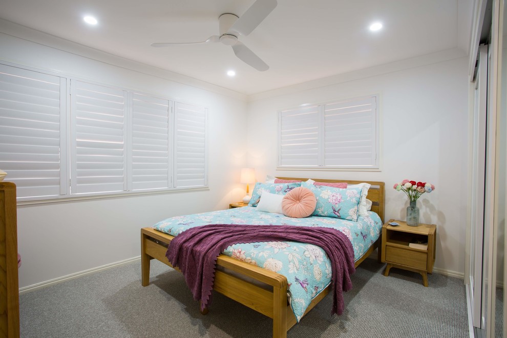 Design ideas for a mid-sized modern master bedroom in Brisbane with white walls, carpet and grey floor.