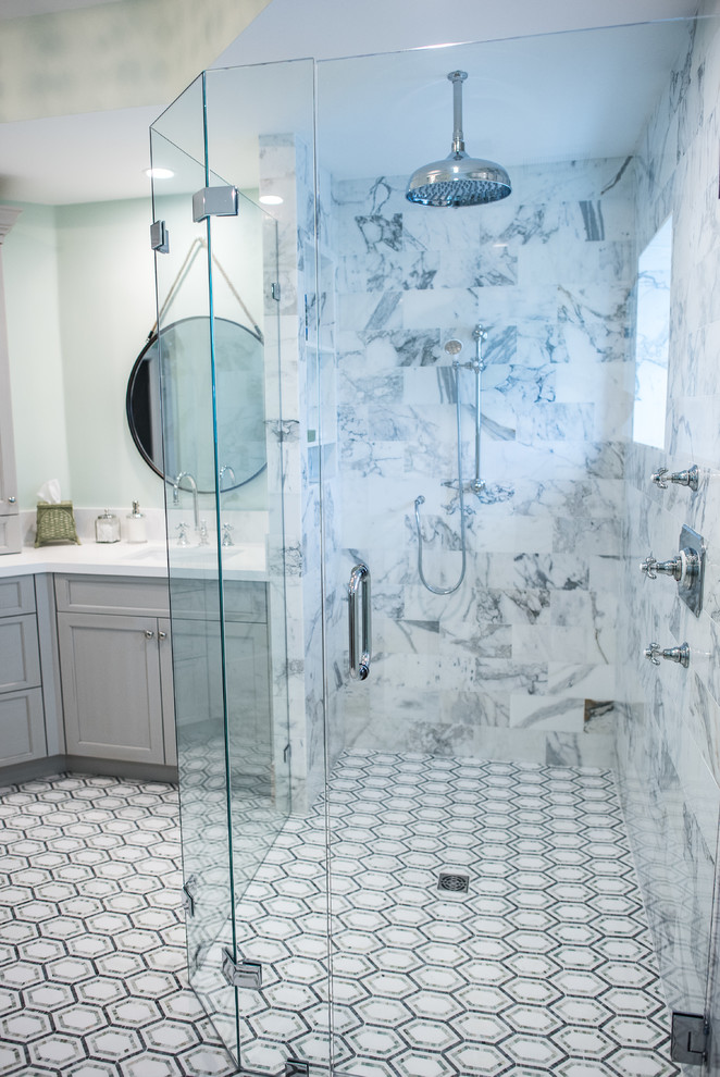 Mid-sized contemporary master bathroom in Miami with shaker cabinets, grey cabinets, an alcove shower, a one-piece toilet, gray tile, white tile, porcelain tile, green walls, mosaic tile floors, an undermount sink and solid surface benchtops.