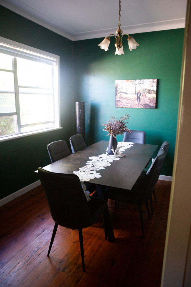 Design ideas for a small urban enclosed dining room in Central Coast with green walls and dark hardwood flooring.