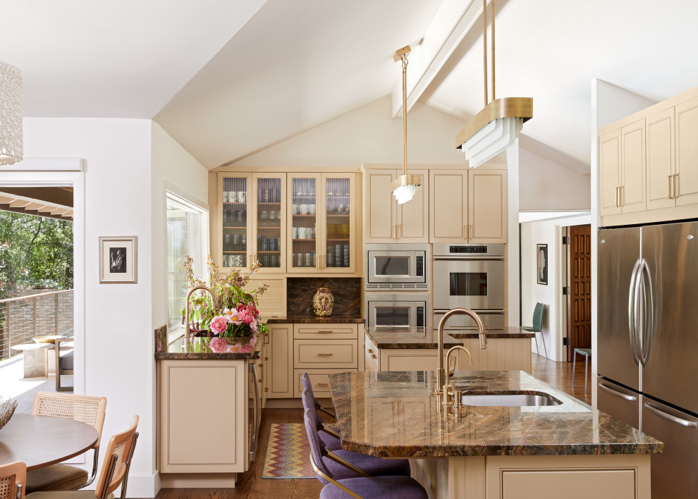 Example of a mid-sized transitional l-shaped medium tone wood floor and brown floor eat-in kitchen design in Austin with a single-bowl sink, recessed-panel cabinets, beige cabinets, marble countertops, marble backsplash, stainless steel appliances, two islands and purple countertops