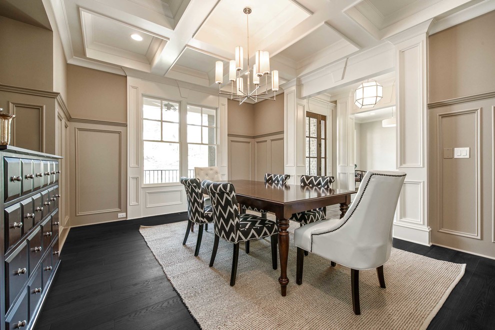 Large modern separate dining room in Atlanta with beige walls, dark hardwood floors, no fireplace and black floor.