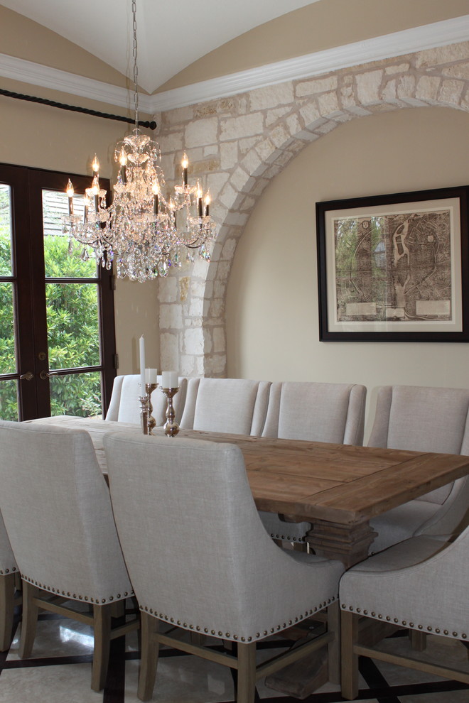 This is an example of a traditional dining room in Miami with beige walls.