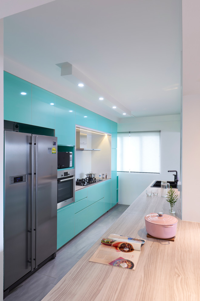 This is an example of a small contemporary galley separate kitchen in Singapore with a double-bowl sink.