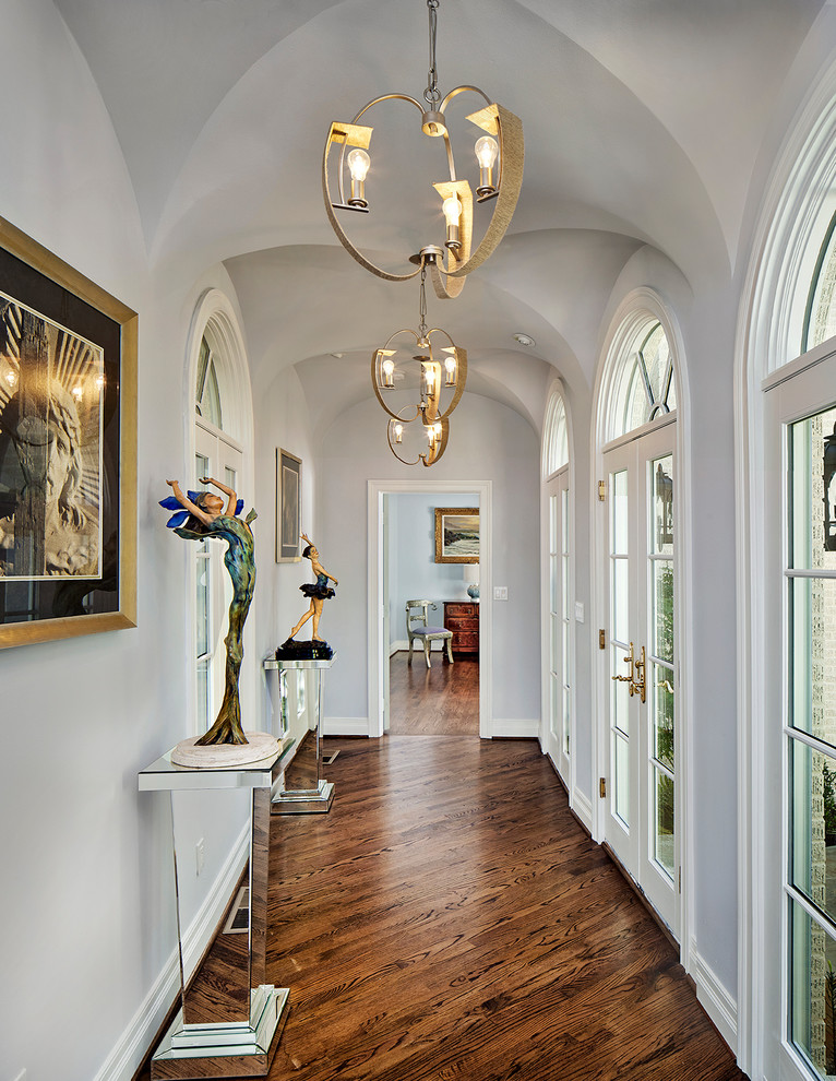 Contemporary hallway in Dallas with white walls, dark hardwood floors and brown floor.