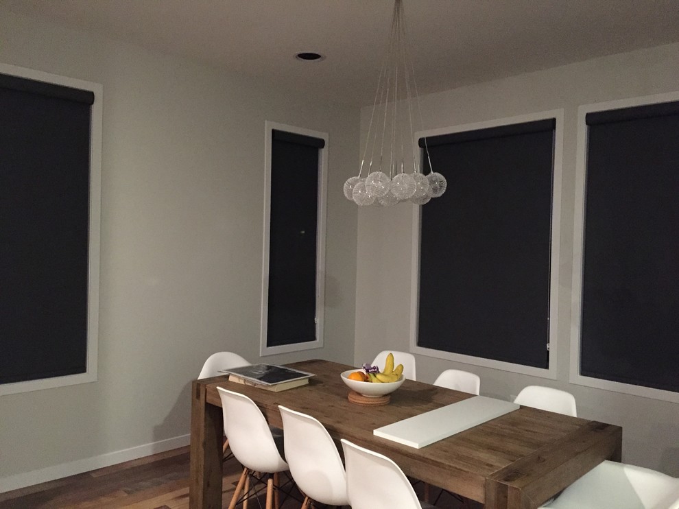 Example of a minimalist dining room design in Calgary