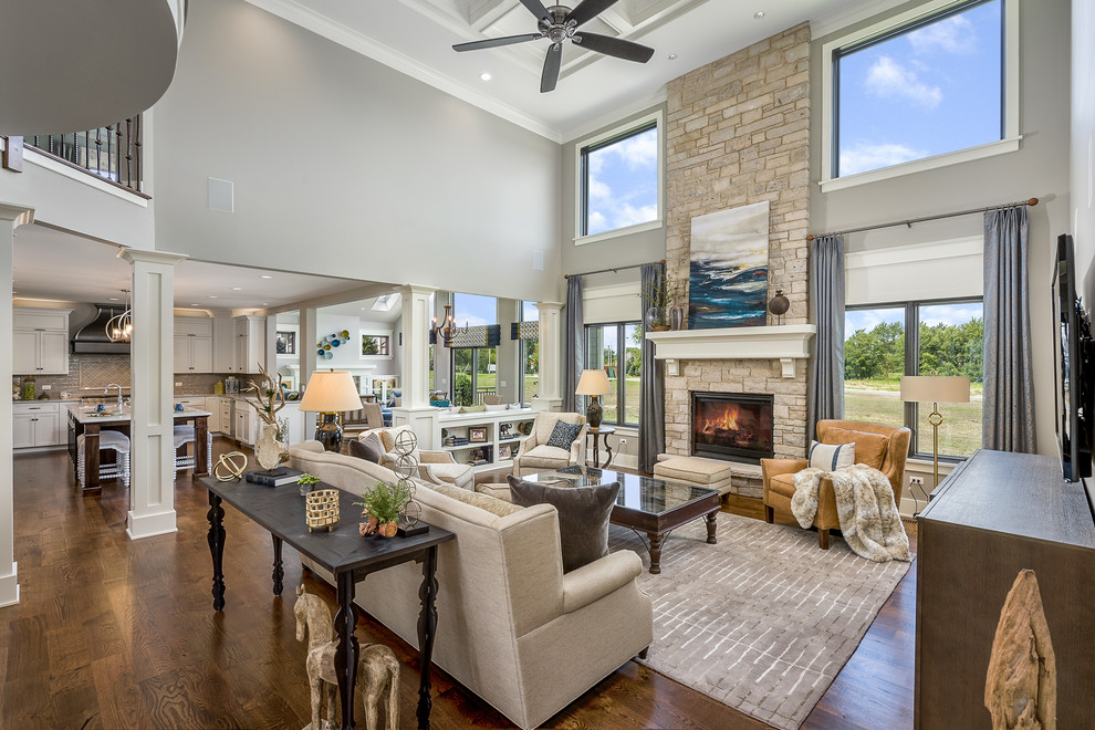 Expansive contemporary open concept family room in Chicago with grey walls, dark hardwood floors, a standard fireplace, a brick fireplace surround, a wall-mounted tv and brown floor.