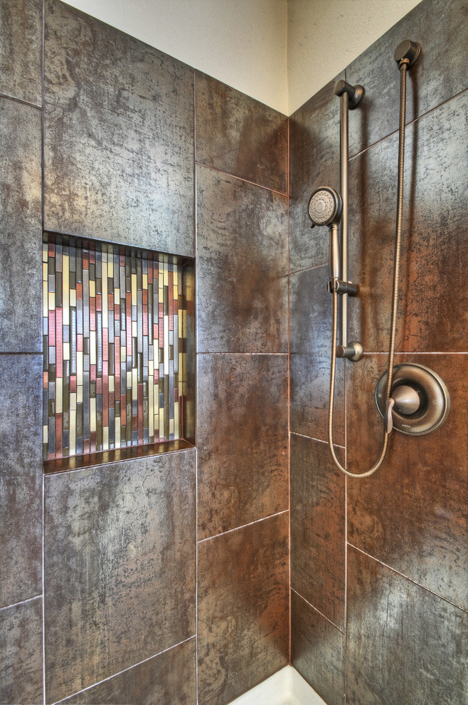 This is an example of a small contemporary master bathroom in Denver with an alcove shower, brown tile and metal tile.