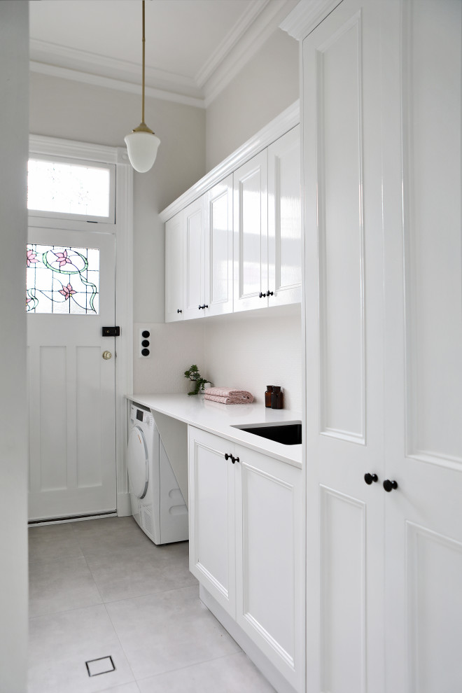 Photo of a traditional laundry room in Perth.